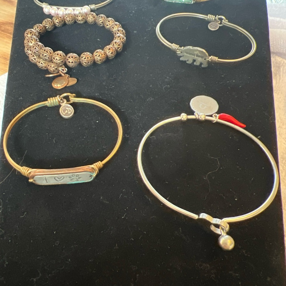 Gold and Silver Tone Bangles, Set of 6
Luca + Danni
Alex & Ani
One unmarked